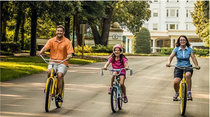 family riding bicycles